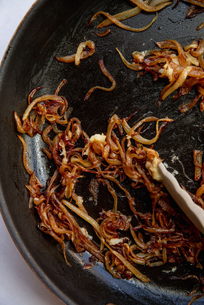 Caramelized onions cooking in a pan after 40 minutes.