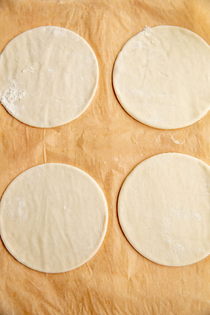 Cut out pieces of puff pastry.