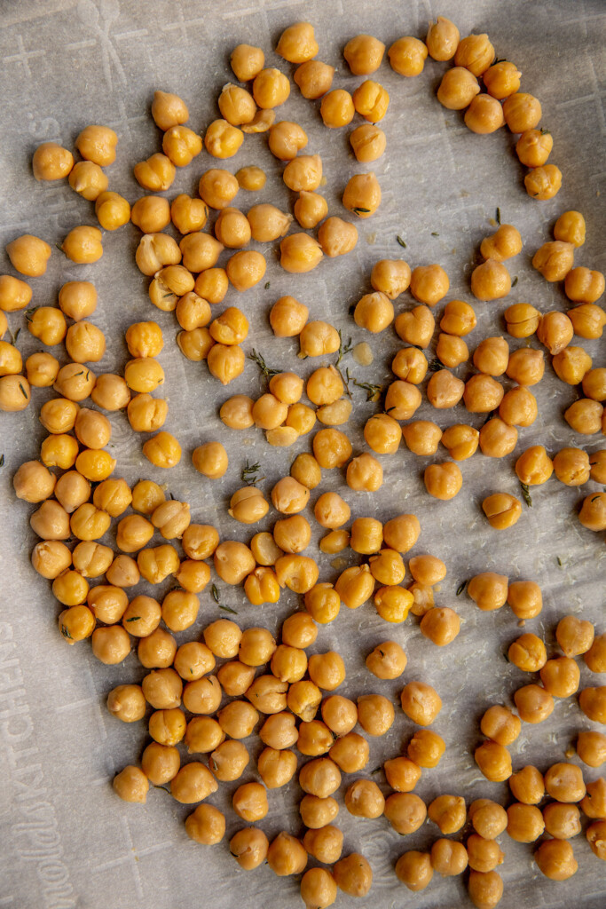 Roasted chickpeas in a baking sheet.
