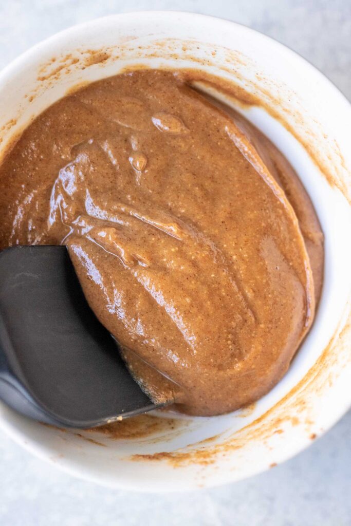 Folding the cinnamon sugar swirl together in a small bowl.