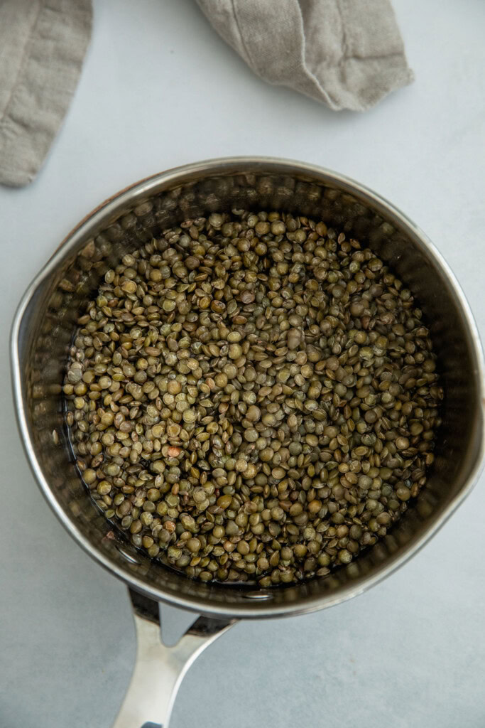 Saucepan with cooked lentils.