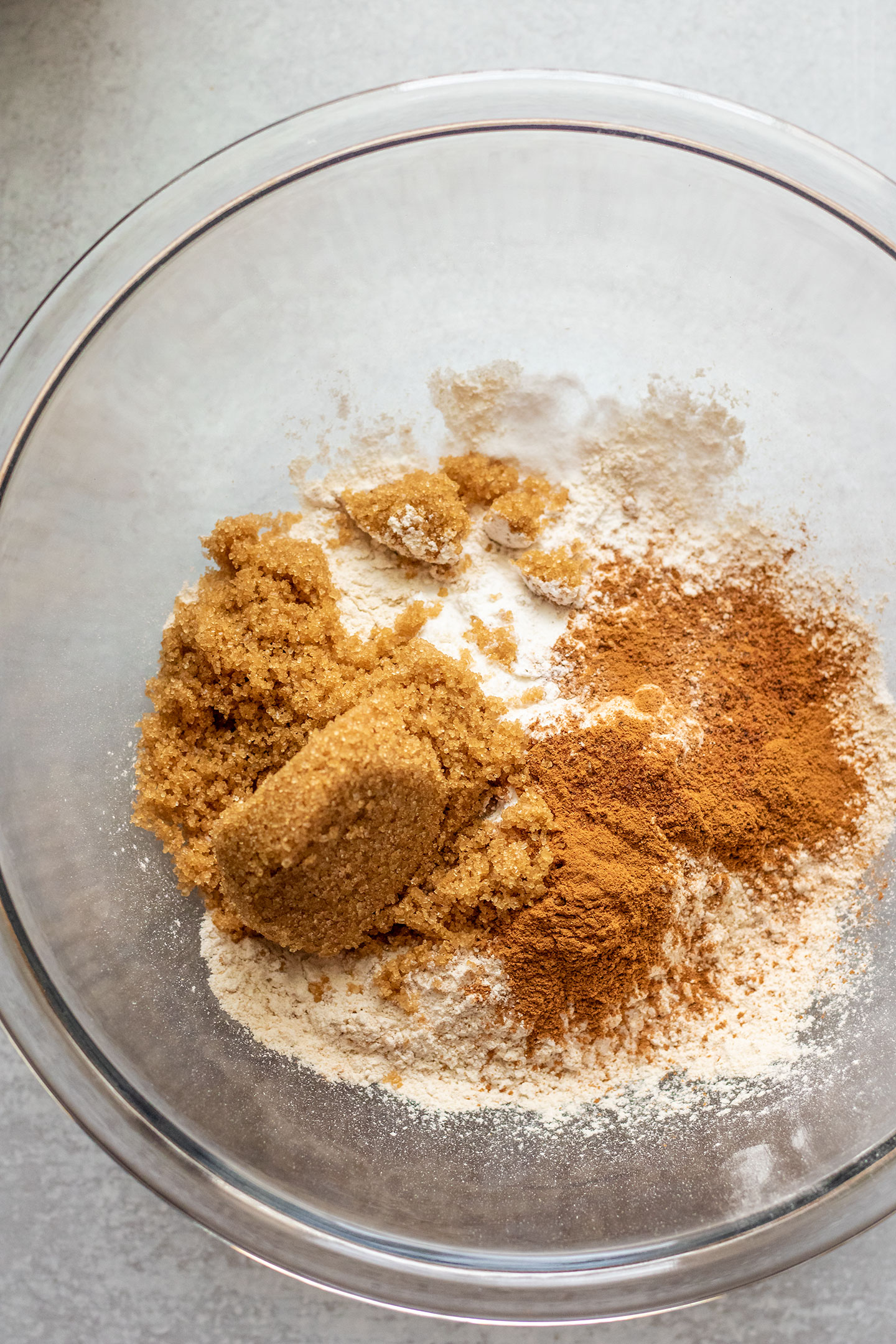 Bowl with all the dry ingredients including flour, sugar, cinnamon, salt and leavening ingredients.