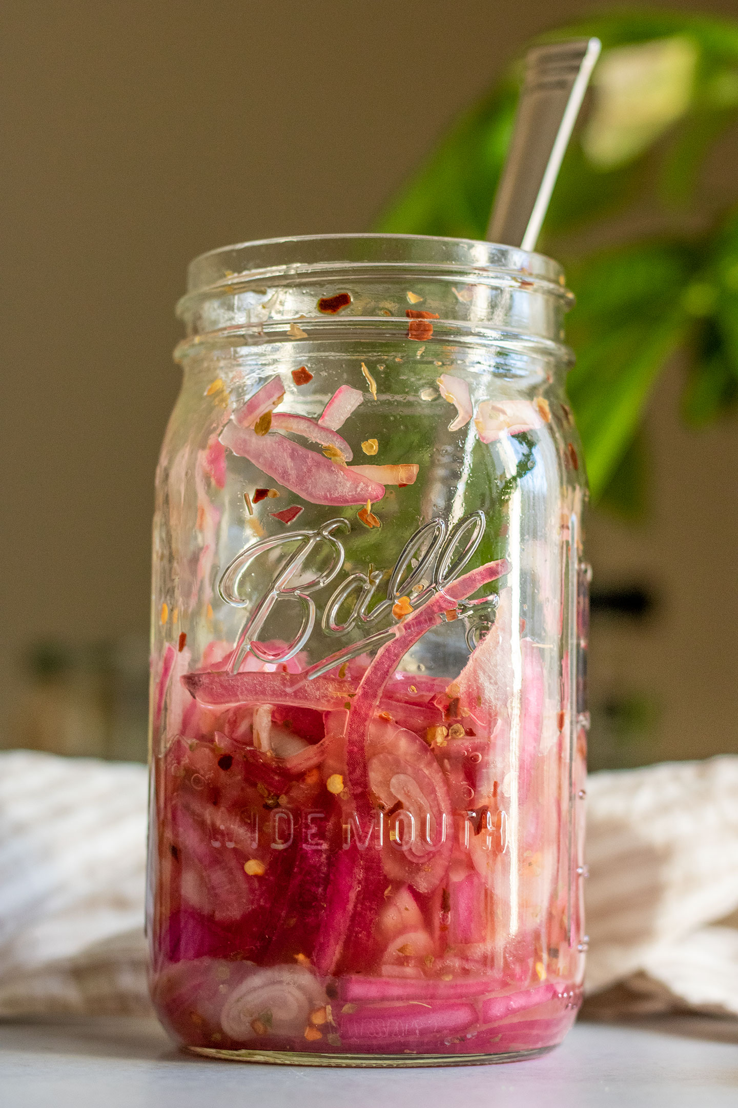 Jar of onions after they have been fully cured in the fridge.