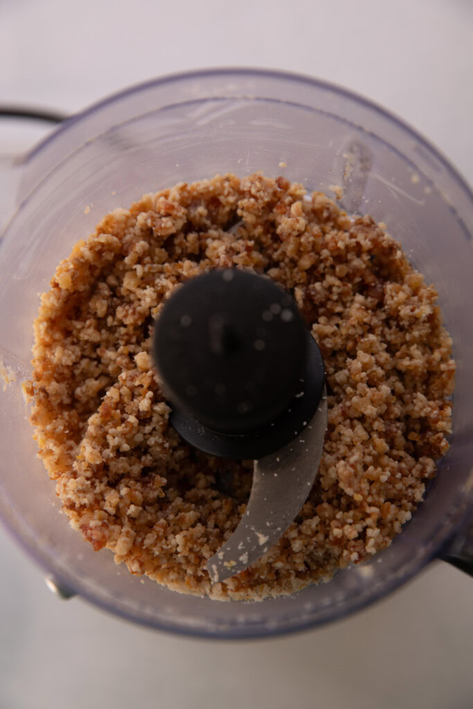 The crumbled pie crust crumble in a food processor.