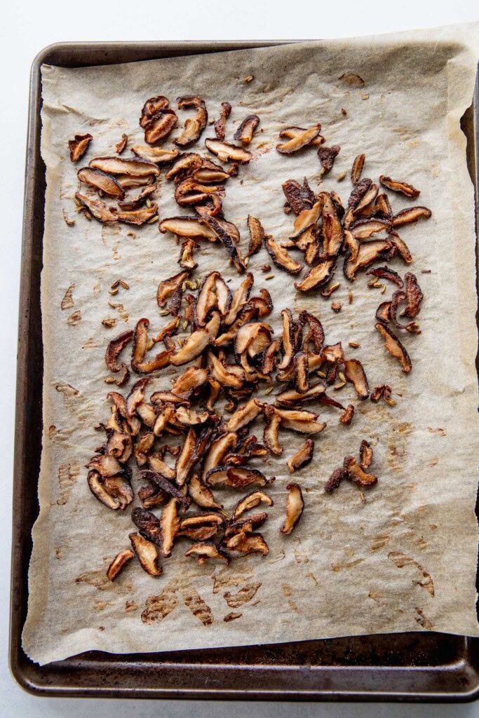 Roasted shiitake mushrooms on a pan.