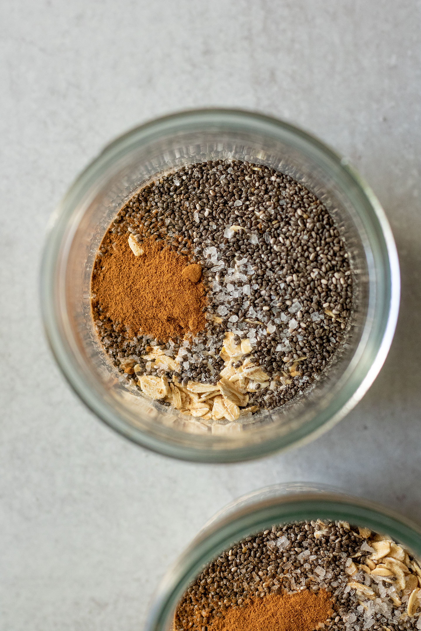 Jar with oats, chia seeds, cinnamon, and salt.