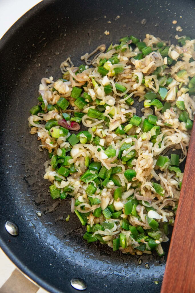 Sauteing the shallots with jalapenos and garlic.