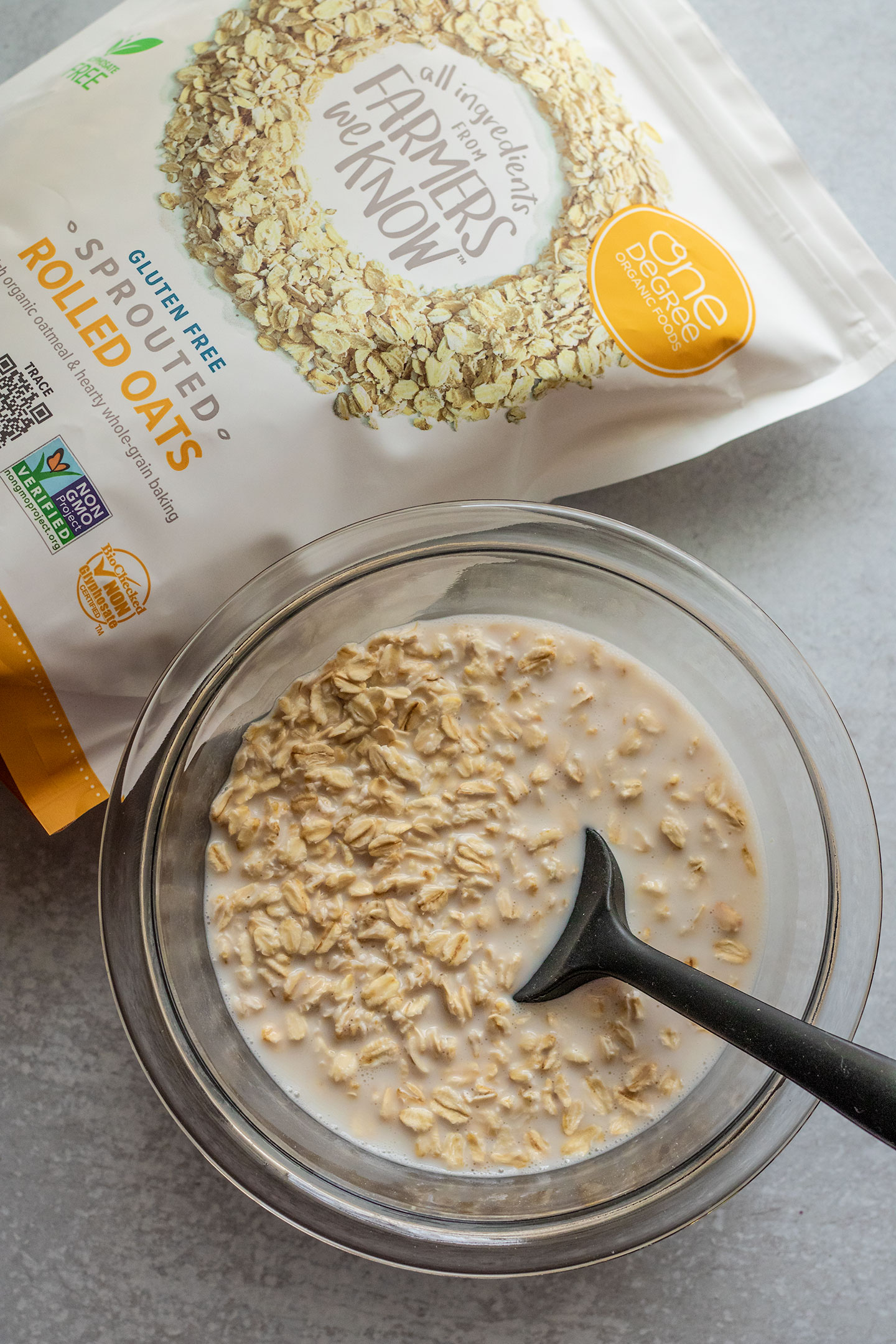 Soaking the rolled oats in plant based milk to soften them.