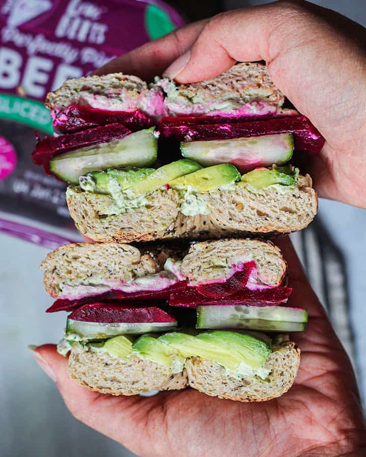 Tofu spread breakfast sandwich loaded with avocado, avocado and pickled beets.