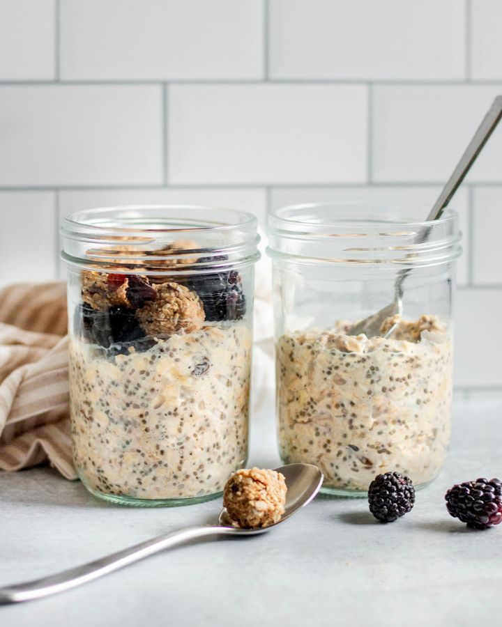 Jar of overnight oatmeal cookie dough with cookie dough bites in two jars with spoons.