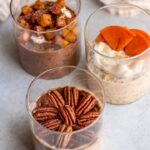 Close up of 3 vegan overnight jar combinations including pecan pie overnight oats, sugar cookie overnight oats and chocolate gingerbread overnight oats.